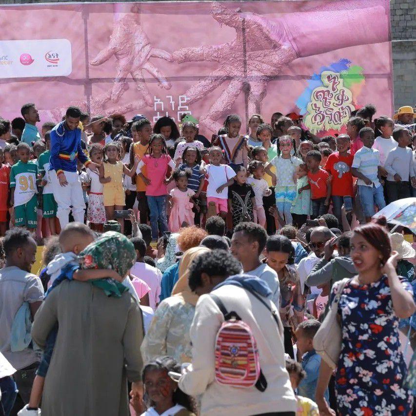 Children painting a mural together
